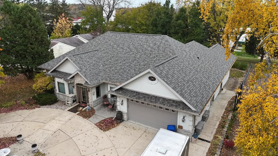 Professional roofing contractor working on a residential roof in Madison WI